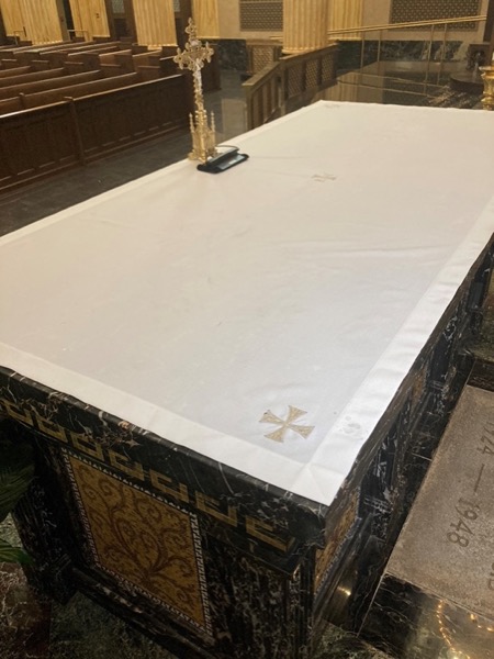 The altar cloth – This cloth covers the altar and traditionally symbolizes the burial shroud of Jesus.