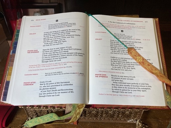 The Roman Missal – The book used by the priest at the altar which contains instructions and prayers for celebrating Mass.  Its name comes from a Latin word meaning pertaining to the Mass.