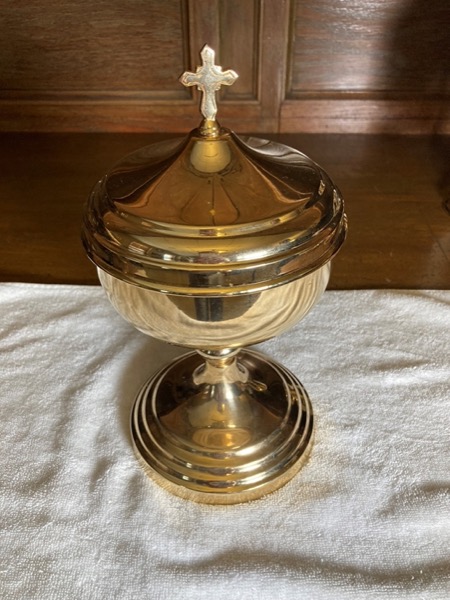 The ciborium – A vessel which holds many hosts and allows for the distribution of Holy Communion to the faithful.
