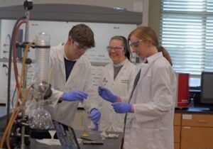 Sister M. Lucy Gantt, FSGM works in a lab with Benedictine College students Caden Bond and Bridget Walker.  

<br>Photo by Sr. Peter Marie Tran, FSGM