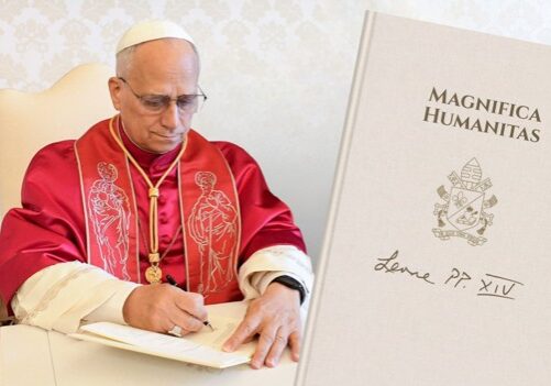 Pope Leo XIV signs his first encyclical, “Magnifica Humanitas: On Safeguarding the Human Person in the Time of Artificial Intelligence,” on May 15, 2026, the 135th anniversary of the encyclical “Rerum Novarum” by Pope Leo XIII. “Magnifica Humanitas” was released on May 25, 2026. | Credit: Vatican Media. Image composition: EWTN News