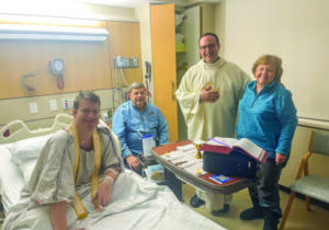 Joining Father Arisman for Mass in his hospital room was his parents, Tom and Elaine Arisman, and Father Zach Samples.


Photo by Dr. Karen Shadle