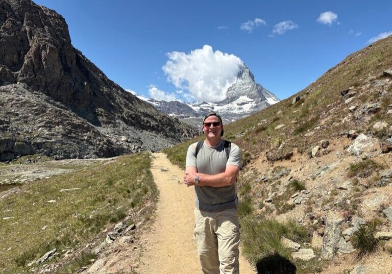 In July 2025, Father Peter Harman is pictured while hiking on the Matterhorn in Switzerland.  